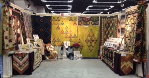 Here's my booth - Plum Tree Quilts and another view follows. . . . .