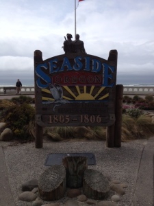 Pacific Ocean behind the sign in the center of Seaside.